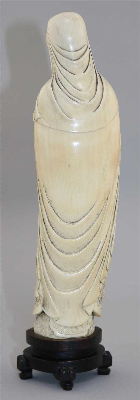 A Chinese ivory tusk figure of Lu Dongbin, late 19th / early 20th century, total height 30.5cm